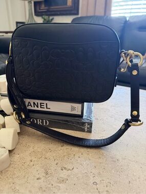 Coach Black Embossed Signature Crossbody with Tassel and Gold Hardware